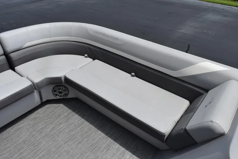 Slide: The Image of 2020 Bennington SX 20 SSX boat interior with gray seating and speaker. - 11