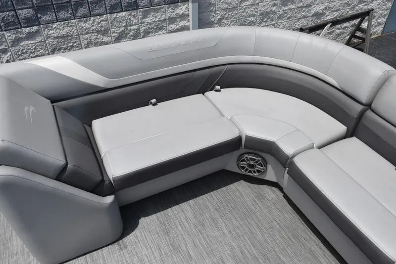 Slide: The Image of 2020 Bennington SX 20 SSX boat interior with gray cushioned seating and speaker. - 12
