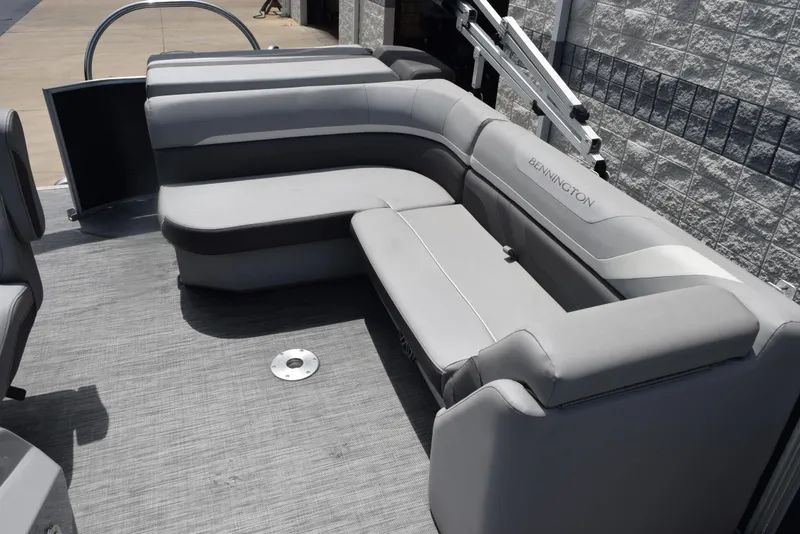 Slide: The Image of Luxurious seating on a 2020 Bennington SX 20 SSX pontoon boat, featuring sleek gray upholstery. - 13