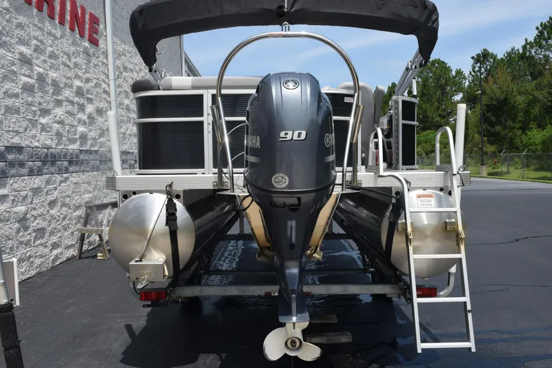Slide: The Image of 2020 Bennington SX 20 SSX pontoon boat with Yamaha 90 engine, parked outdoors. - 5