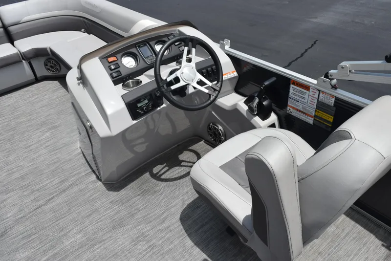 Slide: The Image of 2020 Bennington SX 20 SSX boat interior with steering wheel and seating. - 9