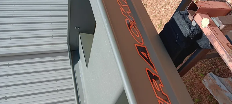 Slide: The Image of Tracker 1542 JON boat, 2026 model, with visible branding and metal siding. - 7