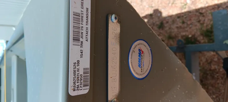 Slide: The Image of Tracker 1542 JON 2026 model label on boat transom with manufacturer sticker. - 8