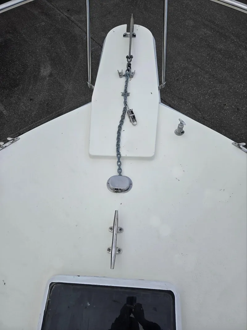 Slide: The Image of 1990 Tollycraft Sport Sedan boat deck with anchor chain and cleat. - 10