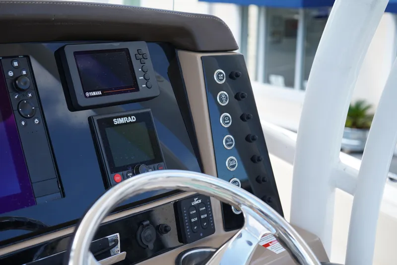 Slide: The Image of 2021 Robalo R230 Center Console dashboard with Yamaha and Simrad displays. - 17