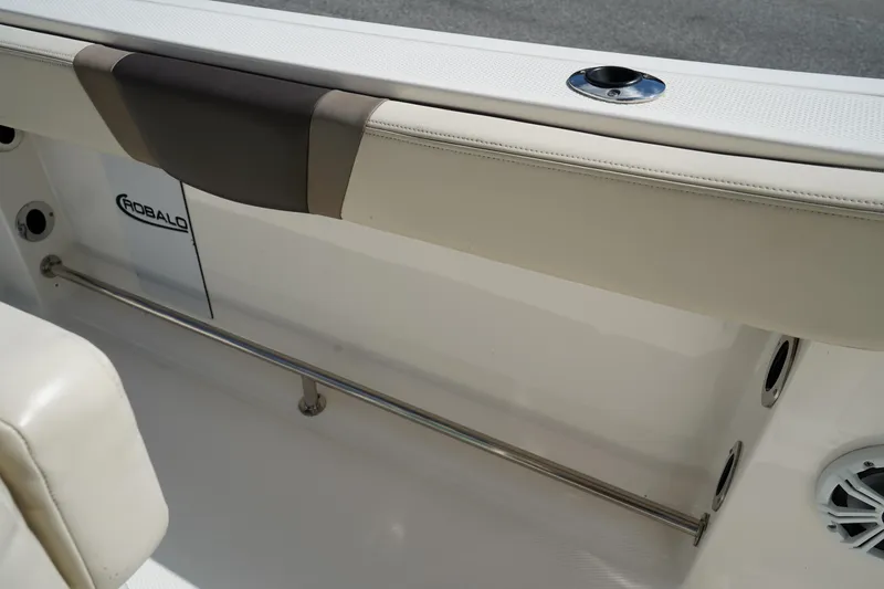 Slide: The Image of 2021 Robalo R230 Center Console interior with rod holder and cushioned seating. - 23