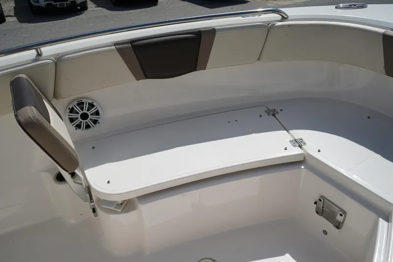 Slide: The Image of 2021 Robalo R230 Center Console boat interior with seating and speaker. - 30