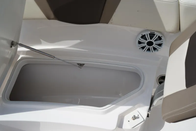Slide: The Image of 2021 Robalo R230 Center Console boat storage compartment and speaker detail. - 32