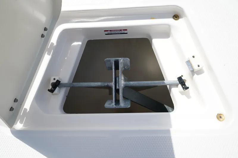 Slide: The Image of Anchor storage compartment on 2021 Robalo R230 Center Console boat. - 34