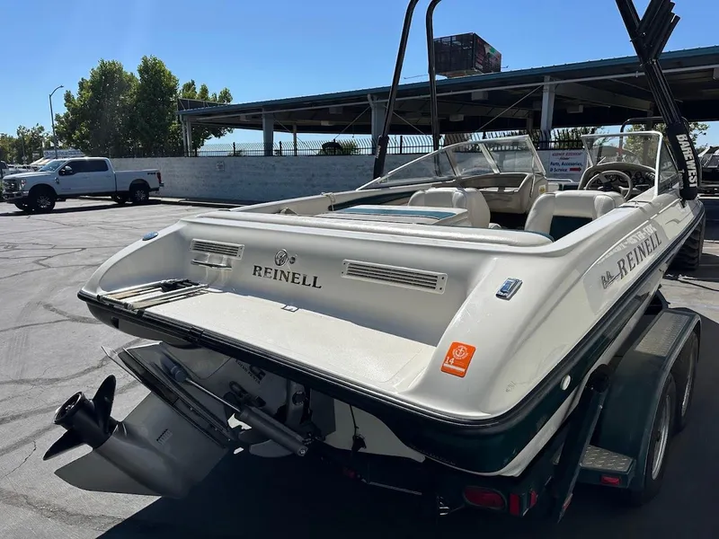 Slide: The Image of 2001 Reinell 203 boat on trailer in parking lot, rear view. - 11