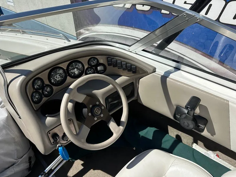 Slide: The Image of 2001 Reinell 203 boat dashboard with steering wheel and instrument panel. - 20