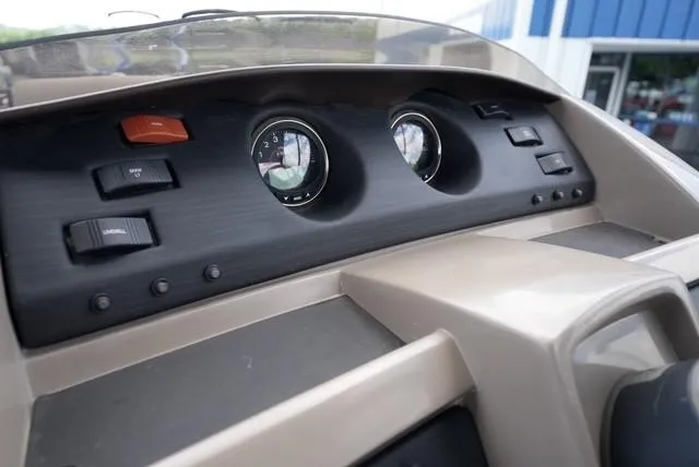 Slide: The Image of Dashboard of a 2019 Bennington 25' Pontoon boat with gauges and controls. - 12