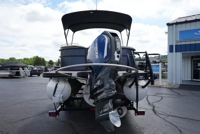 Slide: The Image of 2019 Bennington 25' Pontoon with Evinrude motor, parked outdoors. - 5