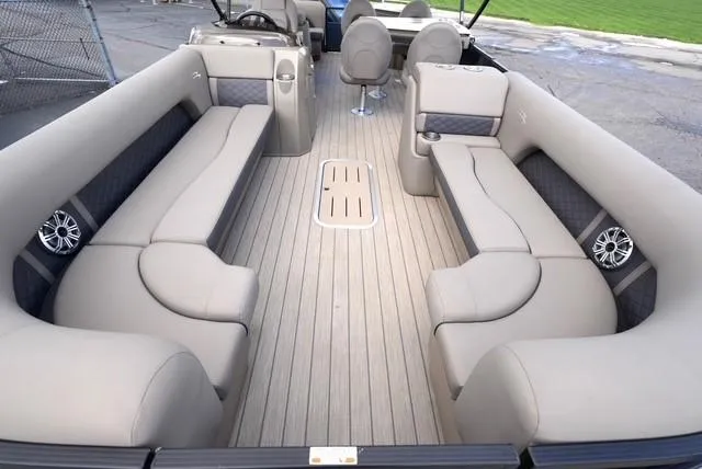 Slide: The Image of 2019 Bennington 25' Pontoon interior with beige seating and modern design. - 8