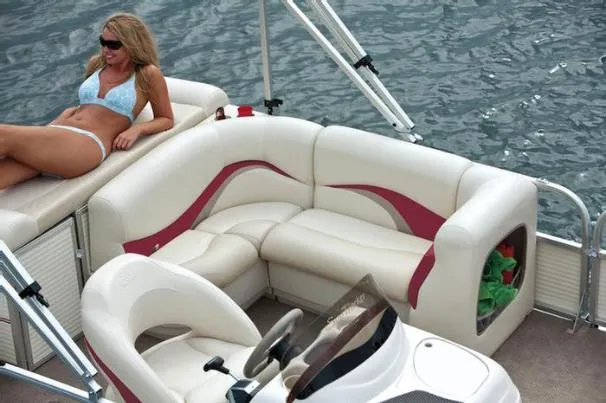 Slide: The Image of Manufacturer Provided Image: The aft sundeck and roomy L-lounge are equally great choices for your day in the sun.
<p>There?s a changing room and storage below the sundeck, and the lounge has storage below as well as in the armrest.</p> - 20