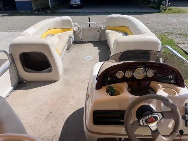 Slide: The Image of 2010 Sun Tracker PARTY BARGE 21 Signature Series interior with seating and steering console. - 4