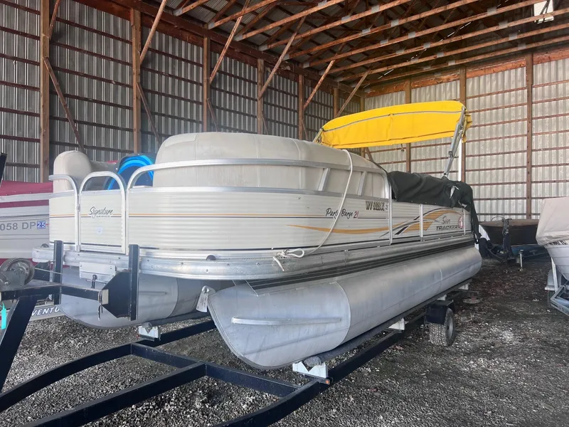 Slide: The Image of 2010 Sun Tracker PARTY BARGE 21 Signature Series pontoon boat in storage shed. - 8