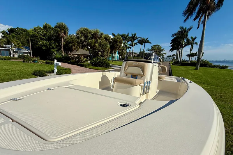 Slide: The Image of 2026 Scout 177 Sport boat on a sunny day by the waterfront. - 19