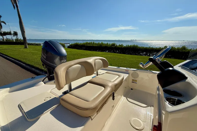Slide: The Image of 2026 Scout 177 Sport boat with Yamaha engine, scenic waterfront view. - 6