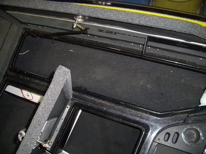 Slide: The Image of Interior view of a 2021 Nitro Z21 boat compartment with storage features. - 13