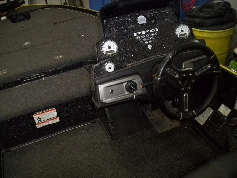 Slide: The Image of Interior of a 2021 Nitro Z21 boat showing steering wheel and dashboard controls. - 15
