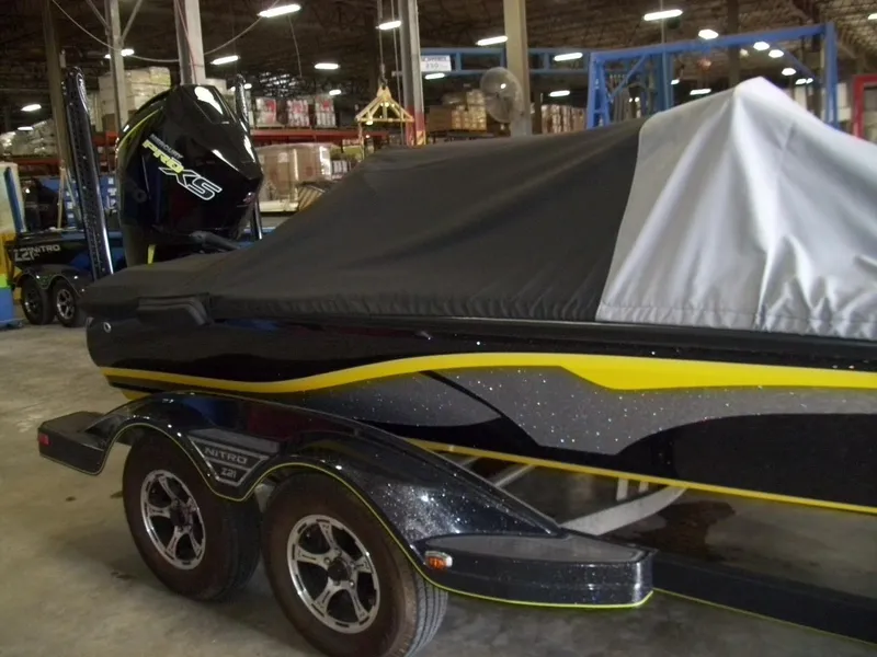 Slide: The Image of 2021 Nitro Z21 boat with cover in a warehouse setting. - 8