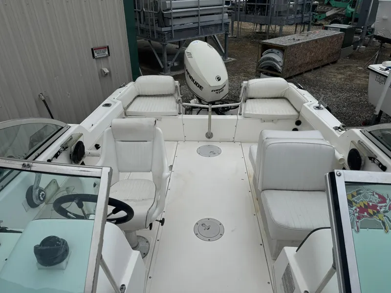 Slide: The Image of 1997 Boston Whaler 20 Dauntless boat interior with seating and steering wheel. - 10