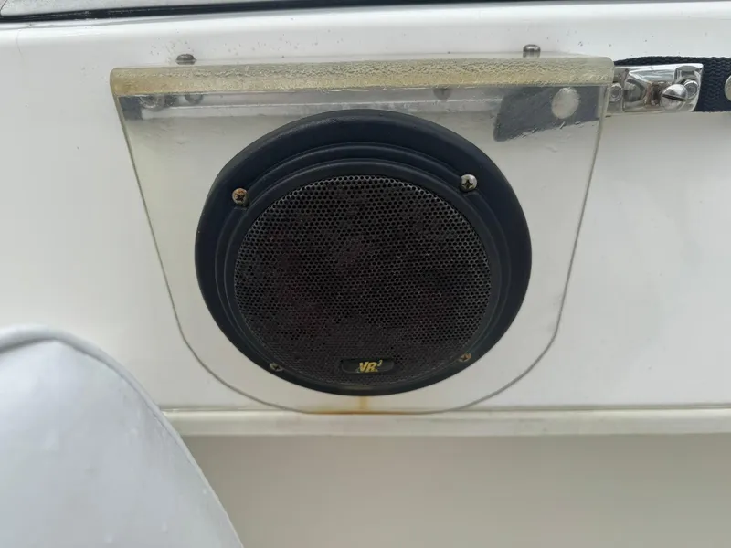 Slide: The Image of Speaker on a 1997 Boston Whaler 20 Dauntless boat, mounted on a white panel. - 14
