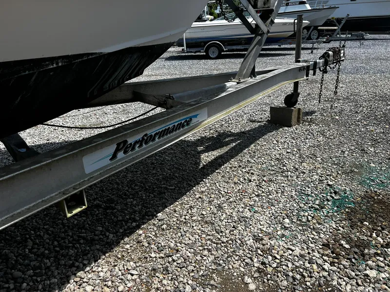 Slide: The Image of Boat trailer for 1997 Boston Whaler 20 Dauntless on gravel lot. - 20
