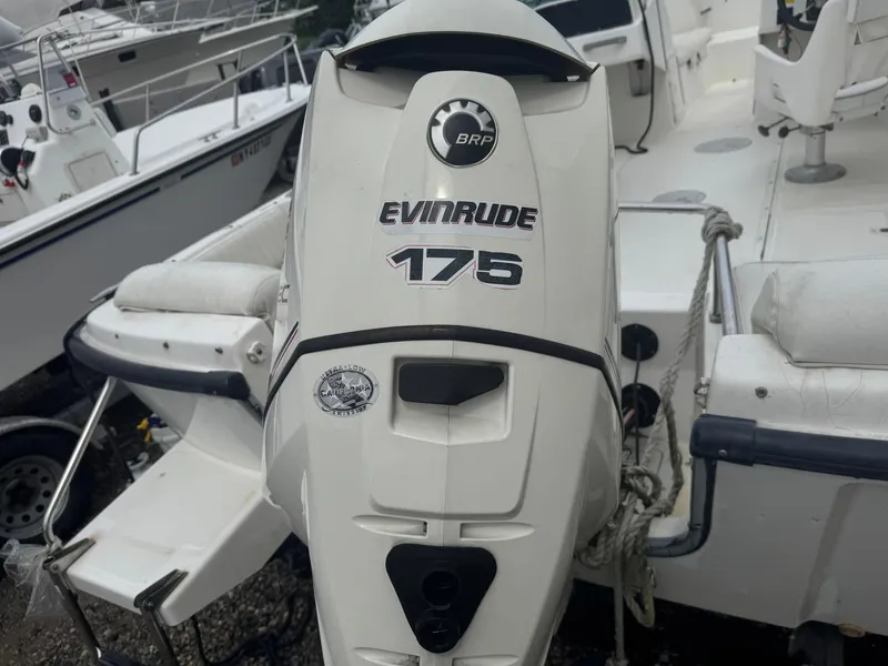 Slide: The Image of 1997 Boston Whaler 20 Dauntless with Evinrude 175 outboard motor, docked. - 4
