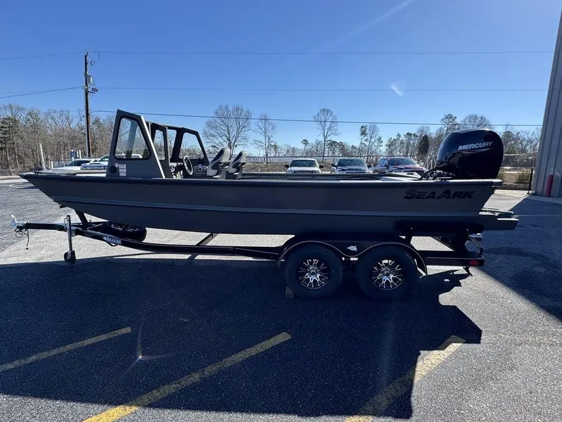 Slide: The Image of 2025 SeaArk 2072 MV Flat Cat boat on trailer, parked outdoors. - 7