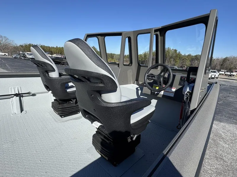 Slide: The Image of 2025 SeaArk 2072 MV Flat Cat boat interior with dual seats and steering console. - 9