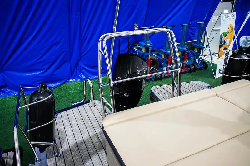 Slide: The Image of 2024 Harris Cruiser 230 boat interior with blue backdrop and equipment display. - 11