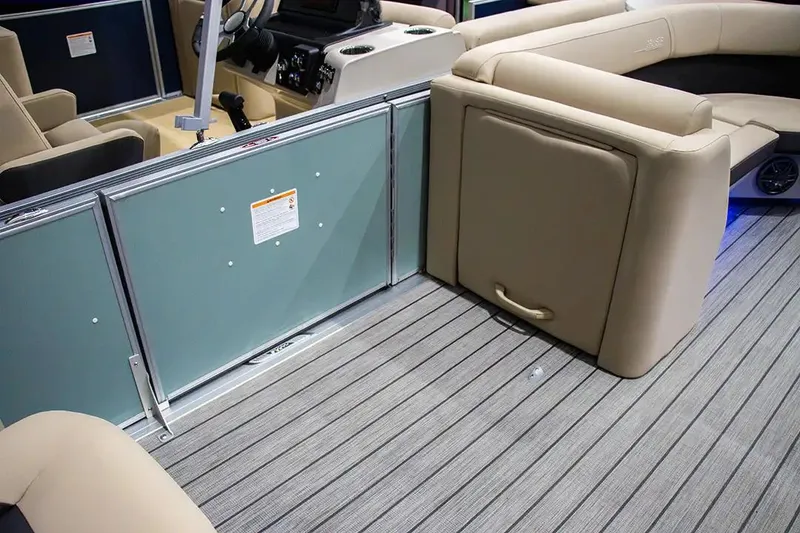 Slide: The Image of 2024 Harris Cruiser 230 interior with beige seating and striped flooring. - 17