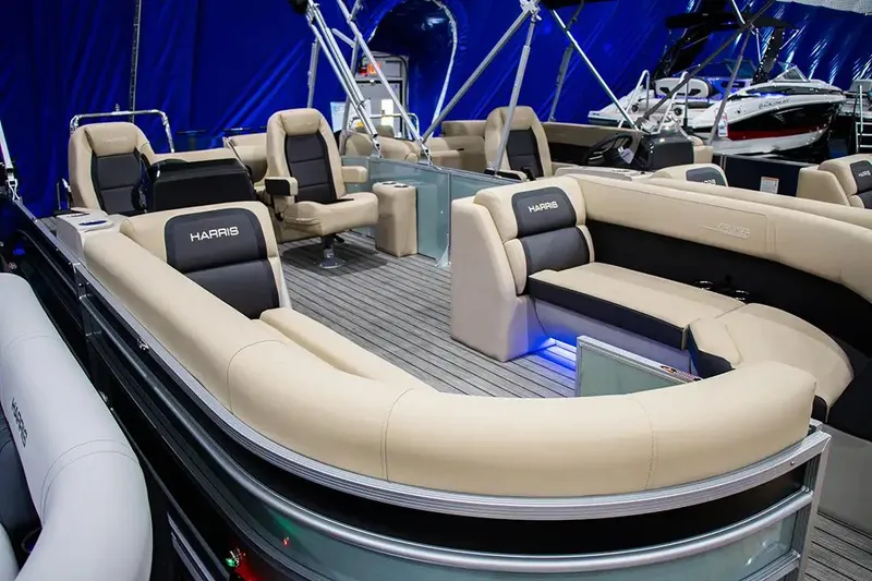 Slide: The Image of 2024 Harris Cruiser 230 pontoon boat with luxurious seating and modern design. - 4