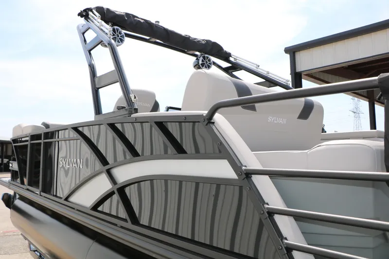 Slide: The Image of 2025 Sylvan L3 CLZ DH pontoon boat with sleek design and modern features. - 12