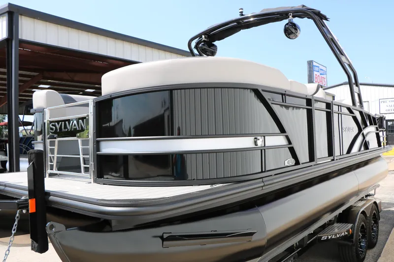 Slide: The Image of 2025 Sylvan L3 CLZ DH pontoon boat with sleek black design and modern features. - 13