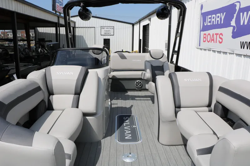 Slide: The Image of 2025 Sylvan L3 CLZ DH pontoon boat with luxurious seating at a dealership. - 17