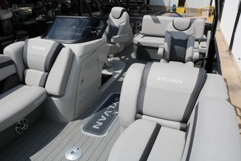 Slide: The Image of 2025 Sylvan L3 CLZ DH pontoon boat interior with luxurious seating and modern design. - 18