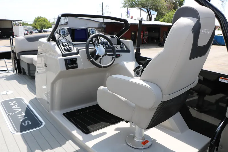 Slide: The Image of 2025 Sylvan L3 CLZ DH boat interior with modern helm and comfortable seating. - 23