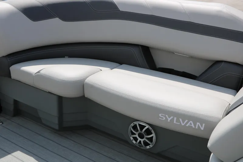 Slide: The Image of 2025 Sylvan L3 CLZ DH boat interior with sleek gray seating and speaker detail. - 26