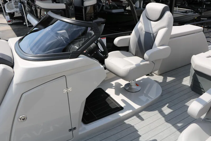 Slide: The Image of 2025 Sylvan L3 CLZ DH boat interior with modern captain's chair and sleek dashboard design. - 29