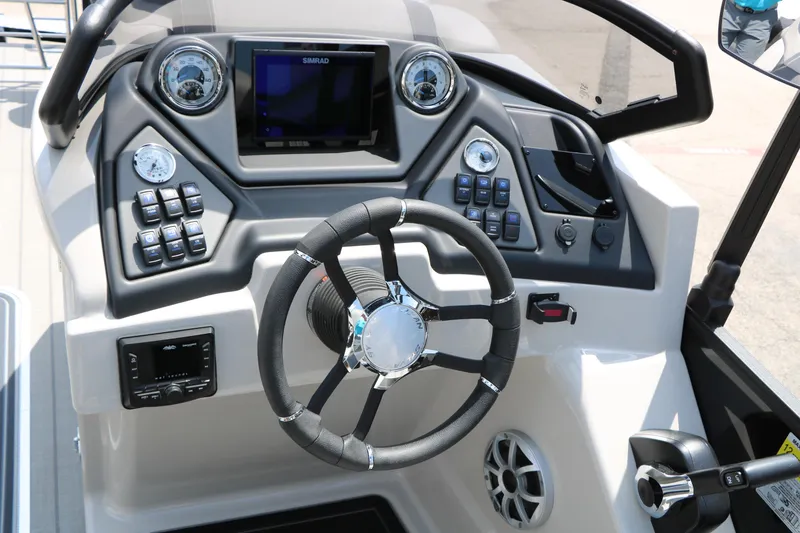 Slide: The Image of 2025 Sylvan L3 CLZ DH boat dashboard with steering wheel and control panel. - 32