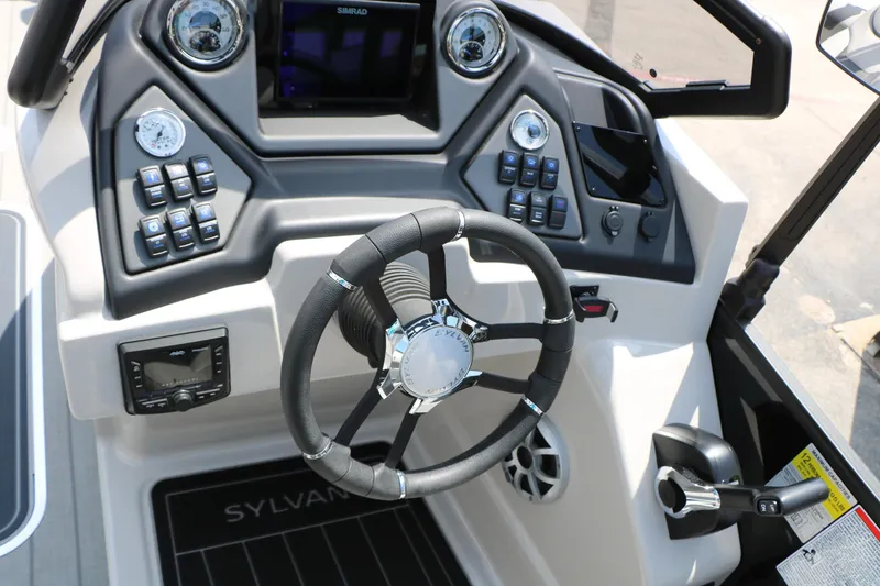 Slide: The Image of 2025 Sylvan L3 CLZ DH boat dashboard with steering wheel and control panel. - 33