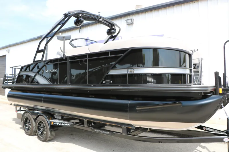 Slide: The Image of 2025 Sylvan L3 CLZ DH pontoon boat on trailer, sleek black design. - 4