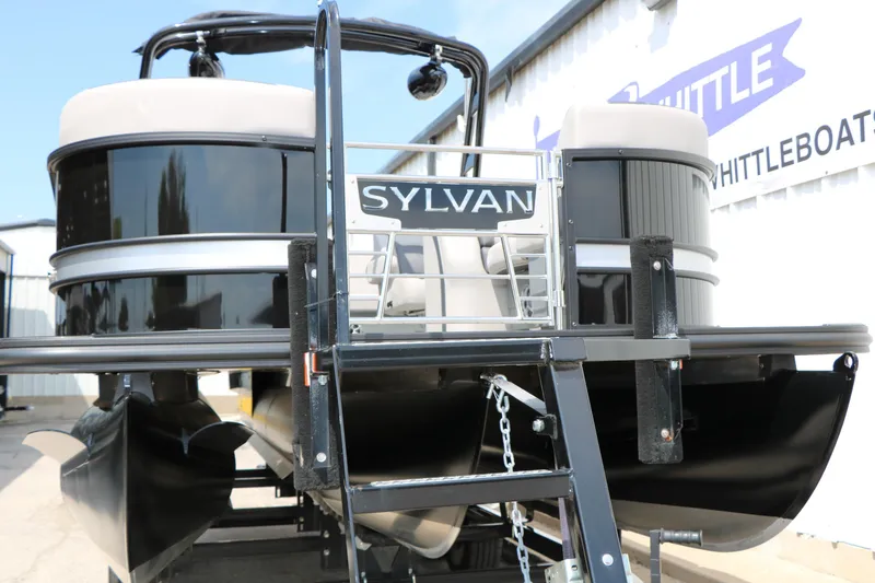 Slide: The Image of 2025 Sylvan L3 CLZ DH pontoon boat, black exterior, displayed outdoors. - 5