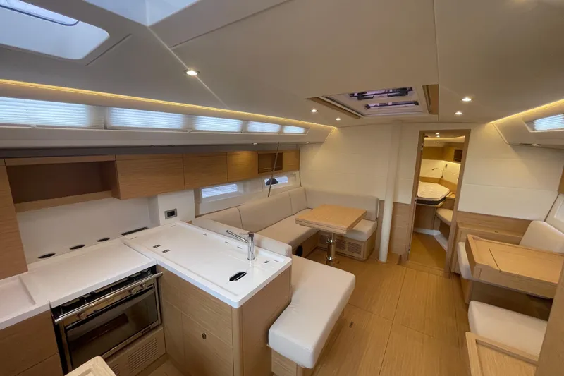 Slide: The Image of Luxurious interior of 2026 Grand Soleil 42 Long Cruise yacht with modern kitchen and seating area. - 10