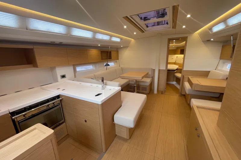 Slide: The Image of Luxurious interior of 2026 Grand Soleil 42 Long Cruise yacht with modern kitchen and seating. - 15