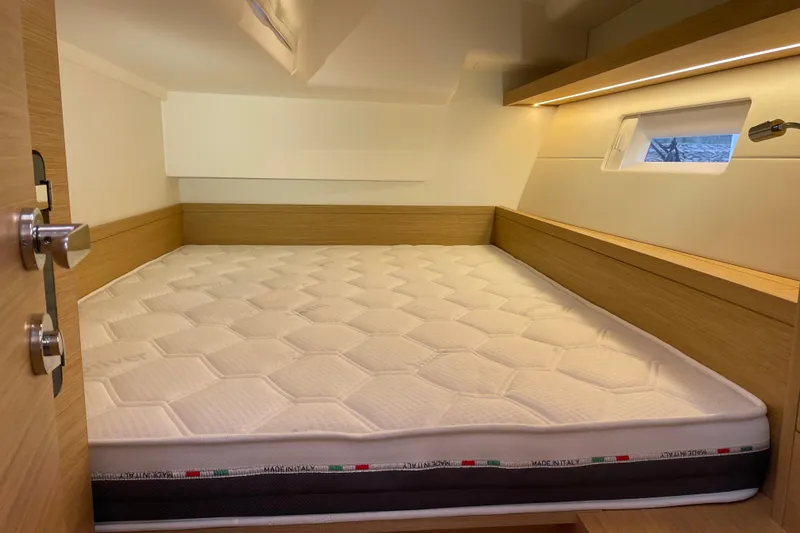 Slide: The Image of Cozy cabin interior of 2026 Grand Soleil 42 Long Cruise yacht with comfortable bed. - 21