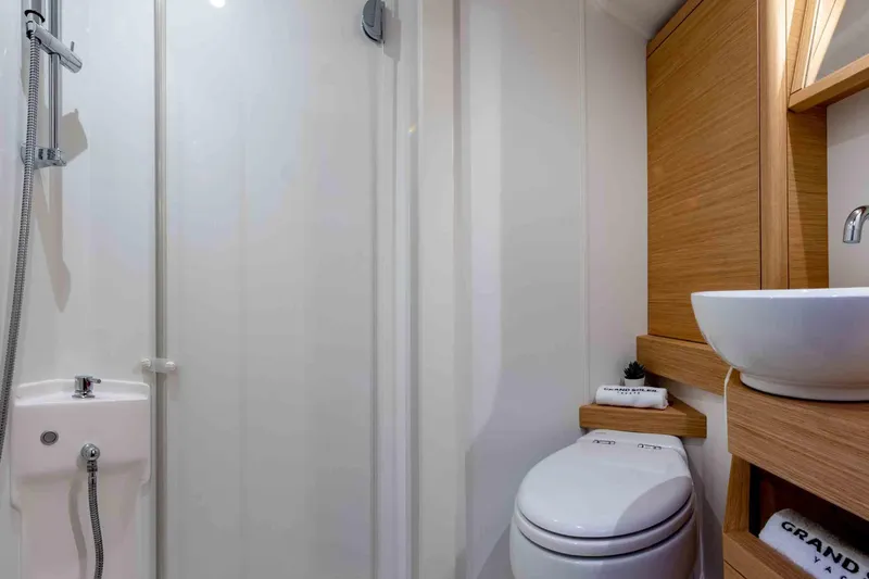 Slide: The Image of Modern bathroom in 2026 Grand Soleil 42 Long Cruise yacht, featuring sleek fixtures and wood accents. - 24